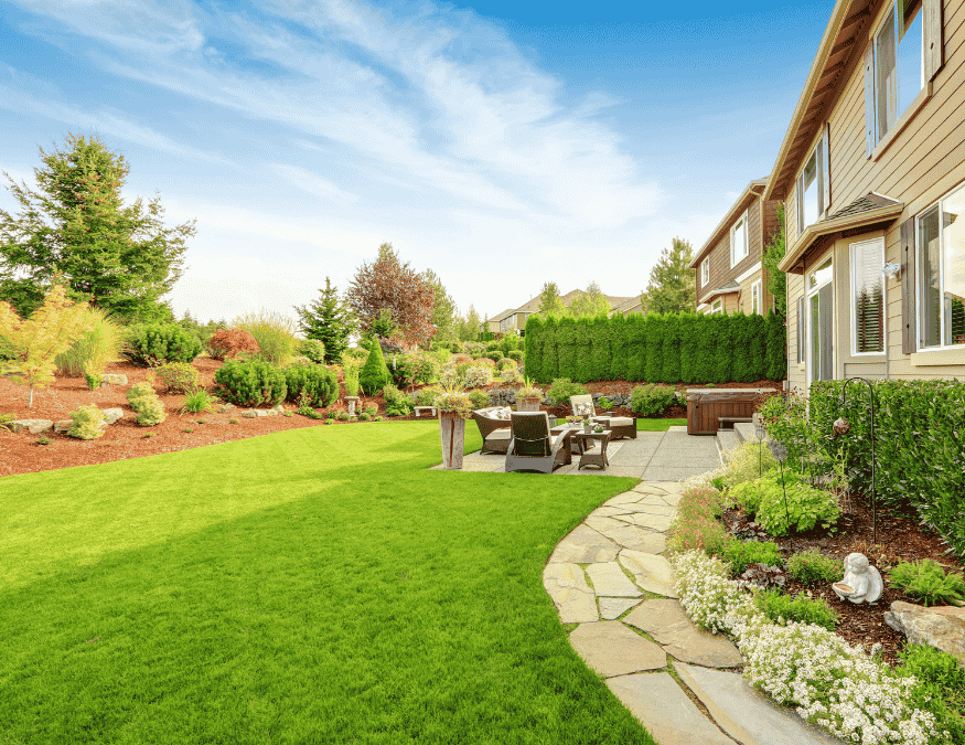 Backyard landscaping in Ottawa with custom patio, garden, and firepit by Ottawa Decking Solutions